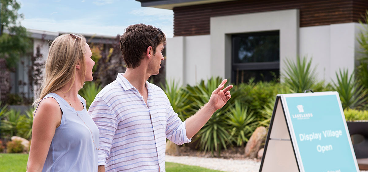 Couple Looking at Display Homes