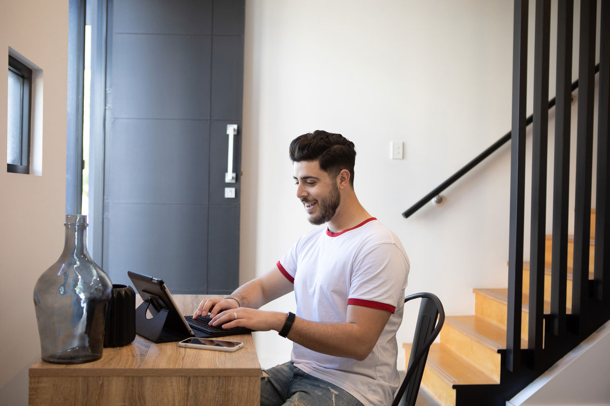 man researching on laptop