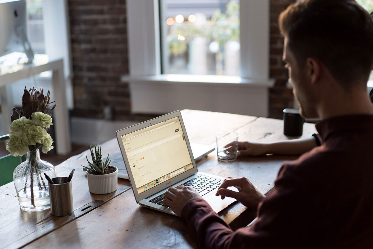 Man with laptop bench