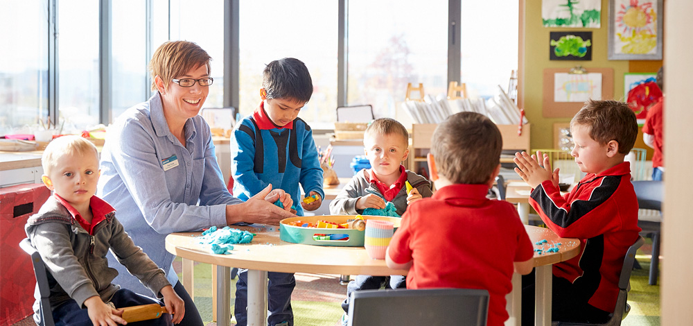 Image of teacher with students