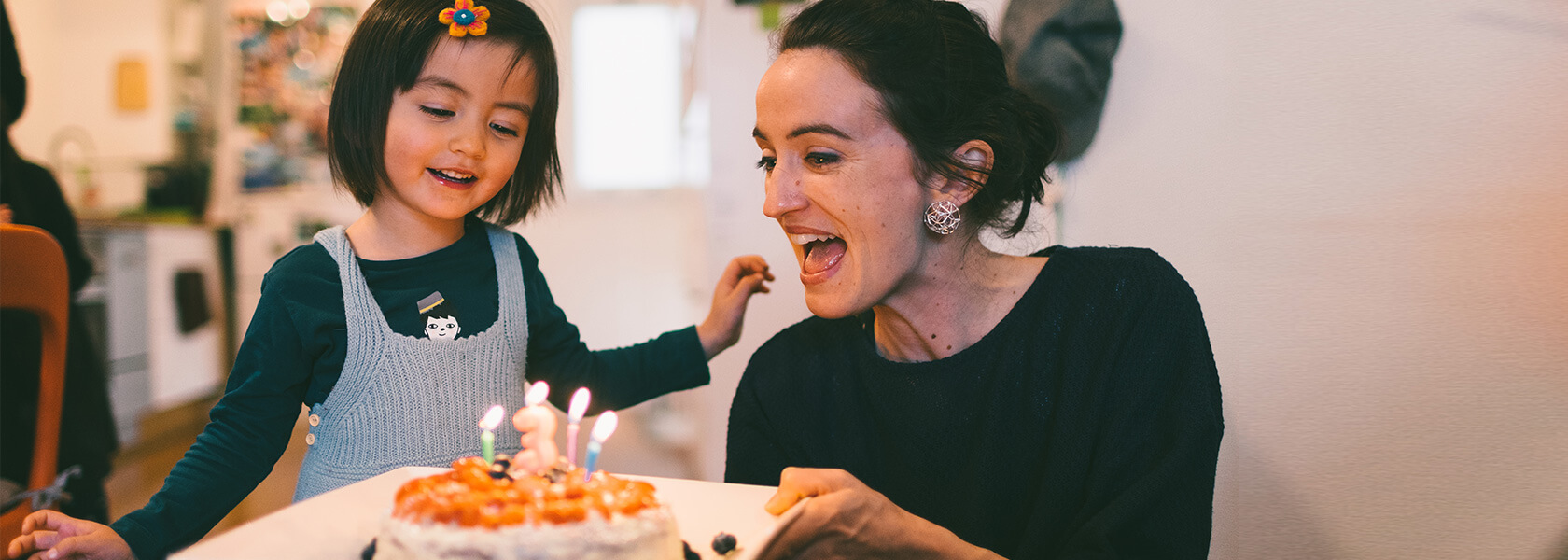 Woman and child celebrating birthday