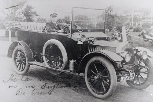 Chauffeur driving the De Dion car to transport would-be purchasers