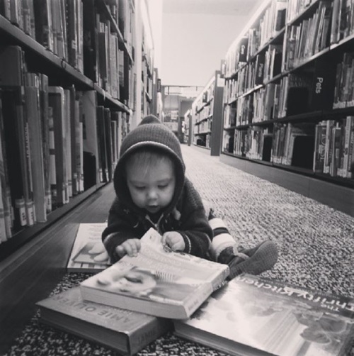 Kid playing at library near Riverbank