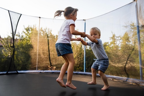 Elavale_Homepage_Kids on trampoline daytime