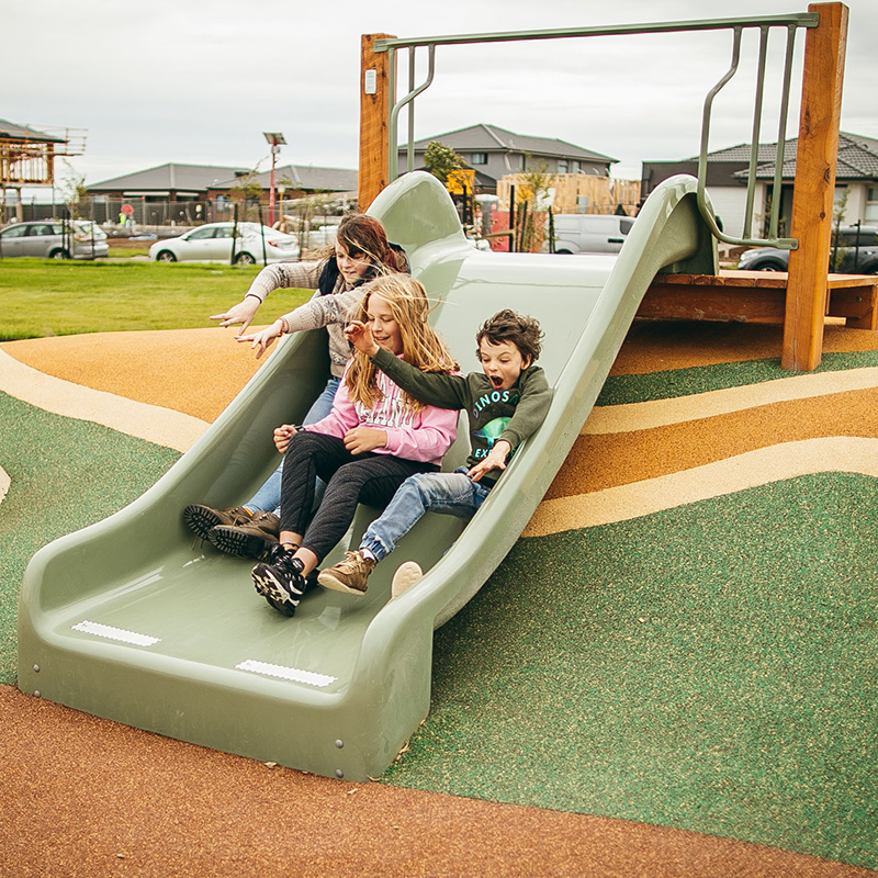 Kids going down slide at Raffle Park