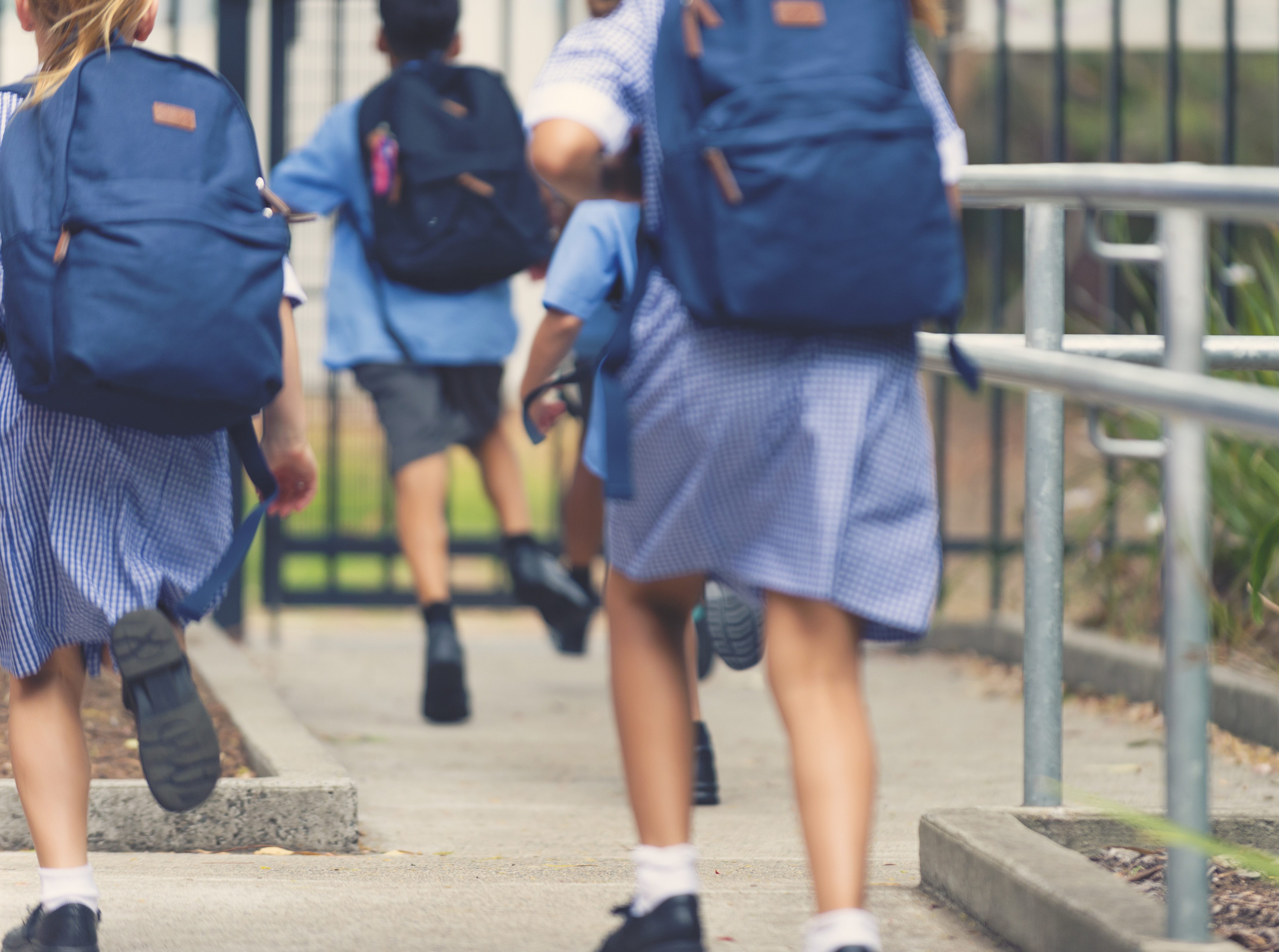 School children walking away.